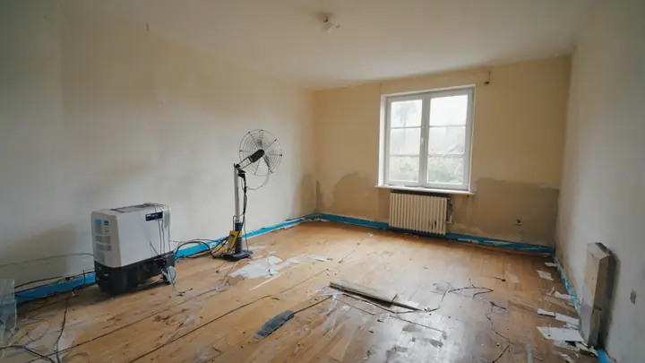 Property interior being cleared and restored after damage